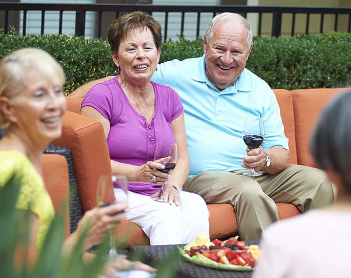 Residents at Alexian Village Milwaukee enjoying drinks and socializing
